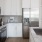 a kitchen with white cabinets