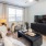 living room with ceiling fan 