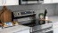 a kitchen with a stove and microwave