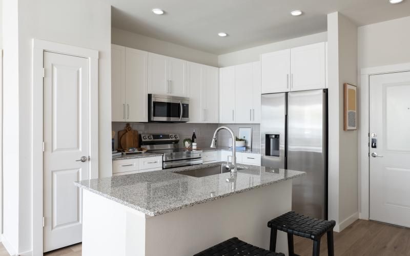 a kitchen with white cabinets